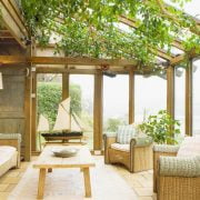 A three seasoned sun-room as the transition of an enclosed patio_Country Living Magazine