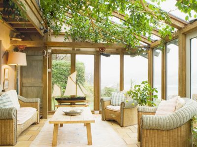 A three seasoned sun-room as the transition of an enclosed patio_Country Living Magazine