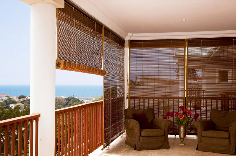 Blinds in faux wood that add a neutral tone to your enclosed patio_Urban Studio Design