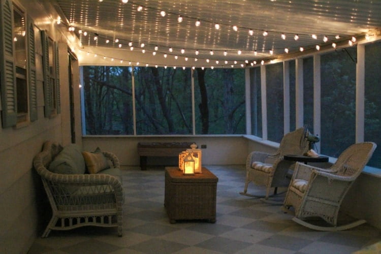 4. An enclosed patio with globe string lights_Lovely