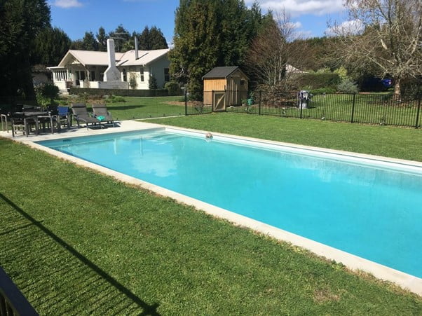 Trim the Grass around your Pool