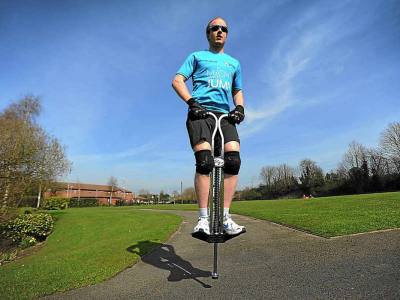 Man Jumping on Pogo Stick