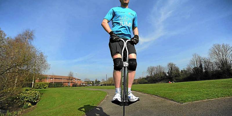 Man Jumping on Pogo Stick