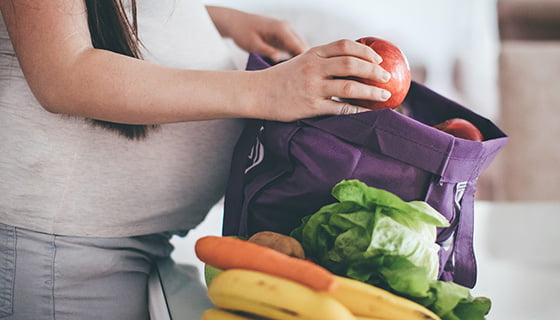 Pregnant woman with Groceries