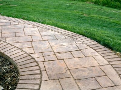 How to Install Pavers Over a Concrete Patio and Driveway