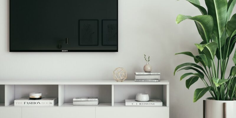 black flat screen tv on white wall