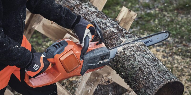 Why do chainsaws cut on an angle?