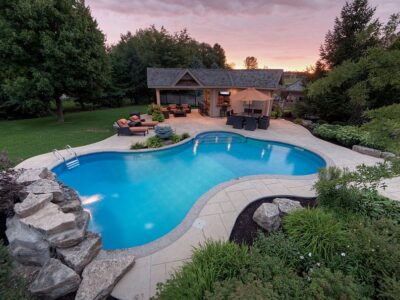 Should I put wood or stone around my pool?