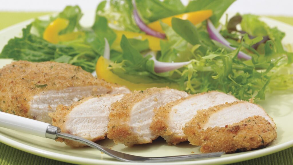 A plate with chicken and salad, a favorite among Israeli citizens.