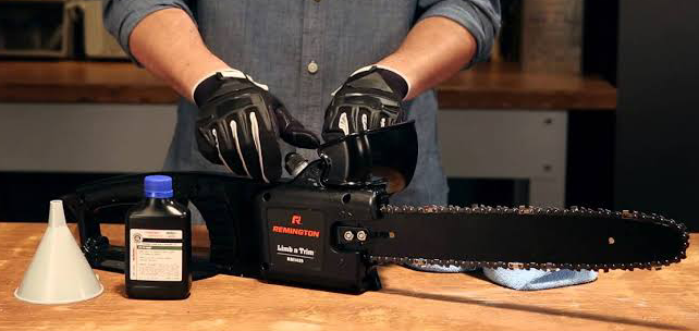 A man maintains the chainsaw blade while cutting wood with precision