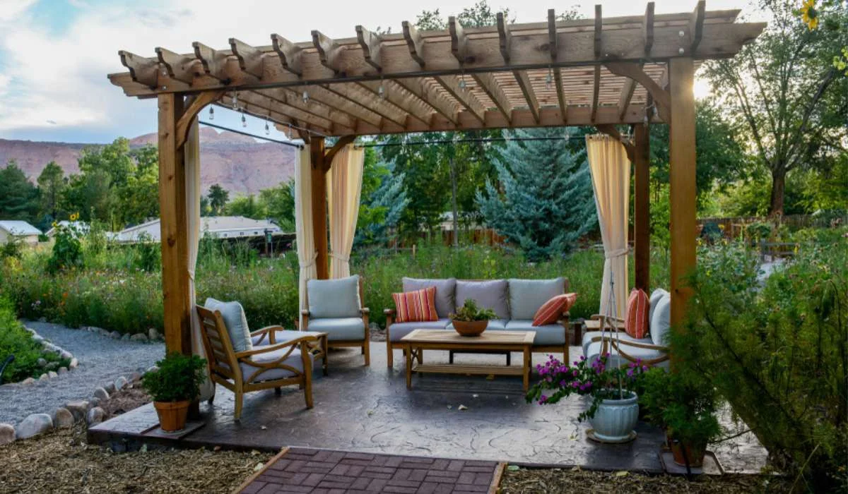 A beautiful pergola with wooden beams and climbing vines