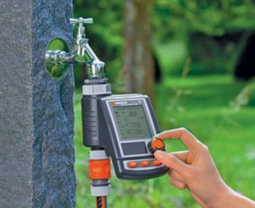 A person using a digital meter to measure the temperature of a stone