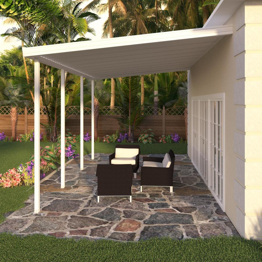 A patio with white awning and chairs