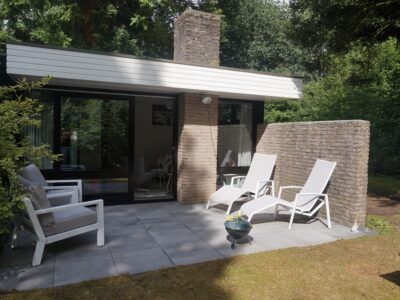 A simple patio with two chairs and a table