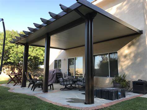 A patio with a covered area and a table