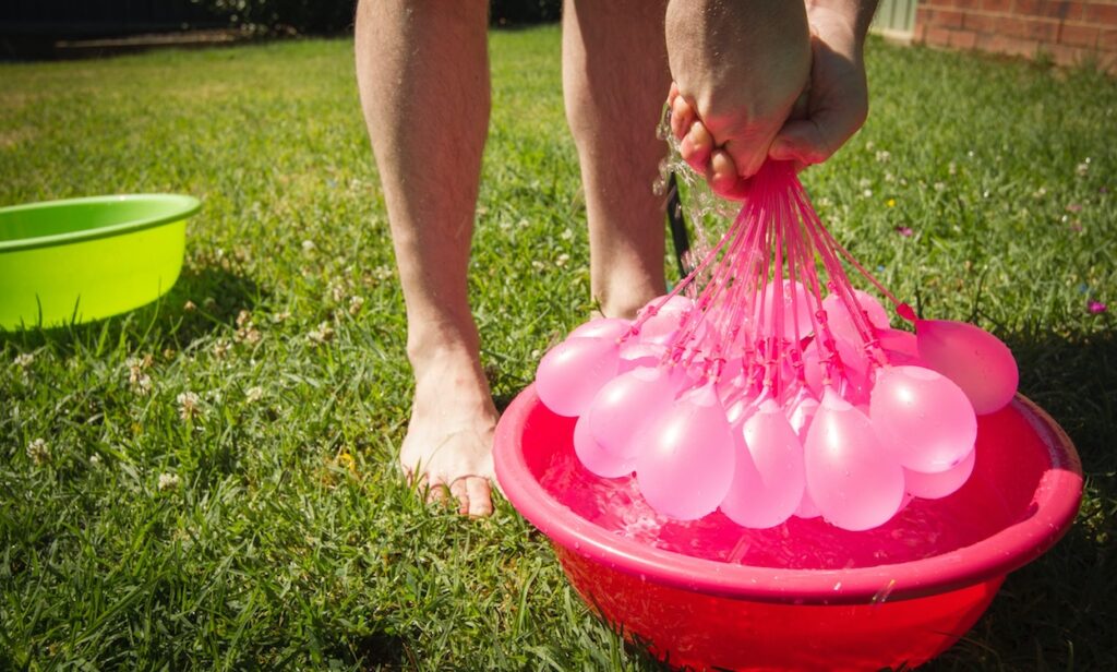 Consider alternatives for water balloons due to environmental concerns.