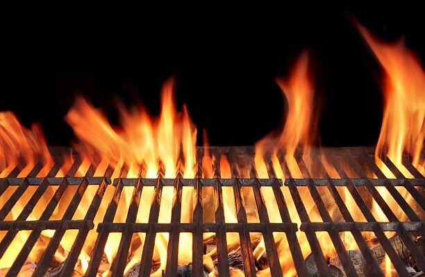 Barbecue Fire Grill close-up, isolated on Black Background