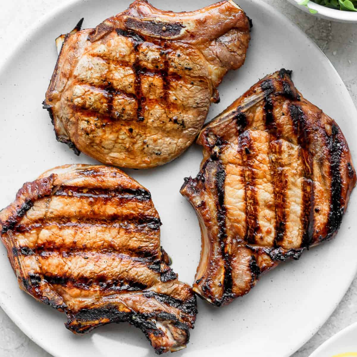 grilled pork chops on a plate