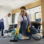 A person cleaning the floor Description automatically generated