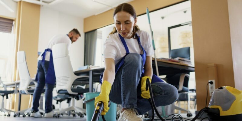 A person cleaning the floor Description automatically generated